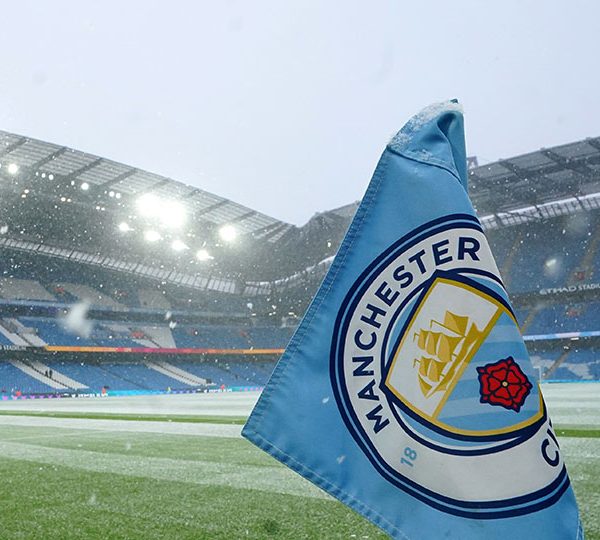 man city flag on the stadium pitch